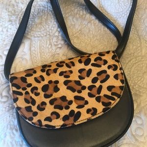 Boutique black leather purse with fur accent